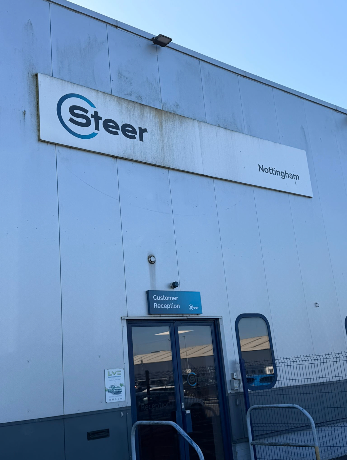 Before cleaning, Steer Nottingham sign and cladding with staining and dirt marks